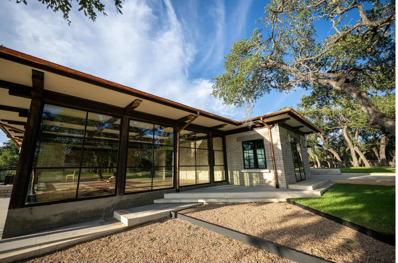 Luna Manor corner exterior with floor-to-ceiling glass walls