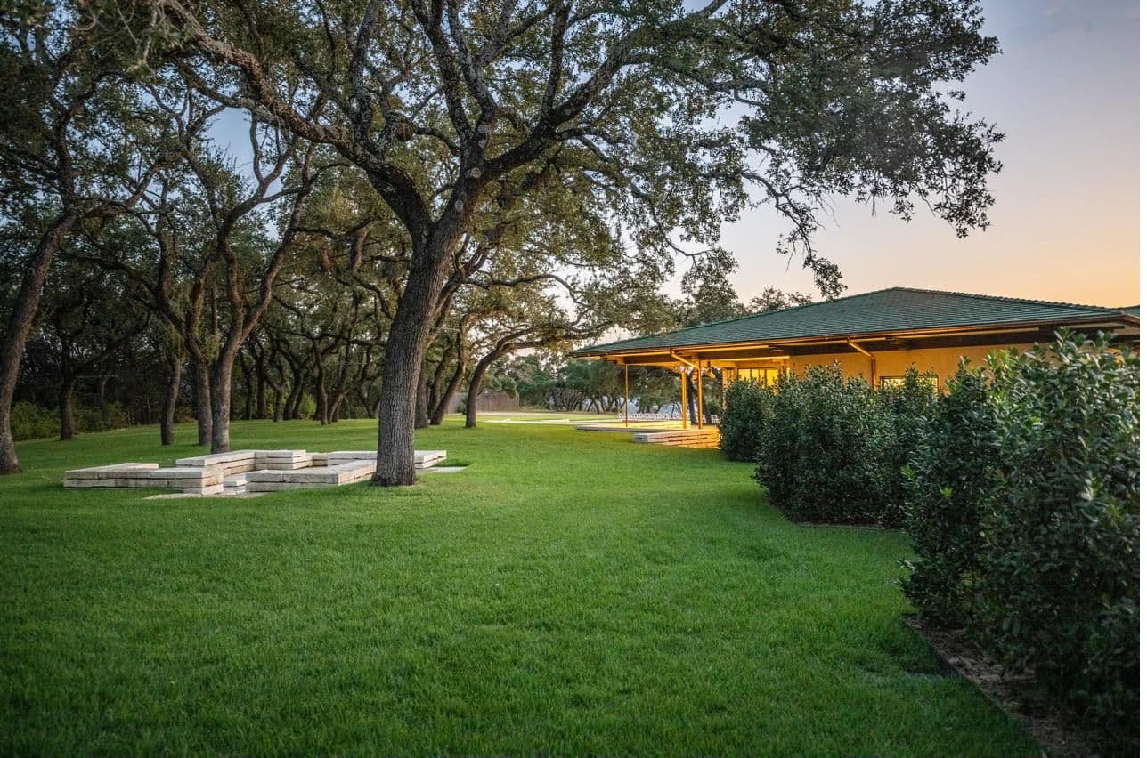 Moon Flower Hill grounds at golden hour — rolling lawns and oaks